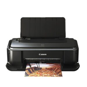 Máy in Canon PIXMA IP2770 màu trắng xám đặt trên bàn làm việc