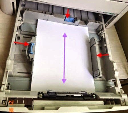 Kiểm tra và đặt giấy đúng cách vào khay máy in Canon 3300