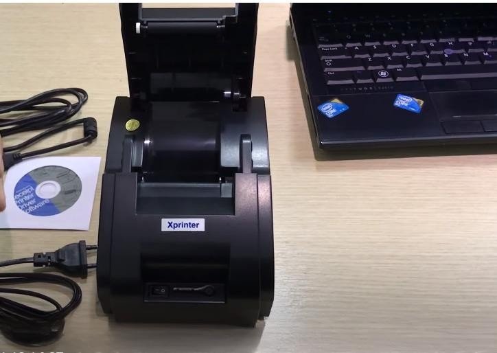 Mở nắp máy in hóa đơn để lắp giấy