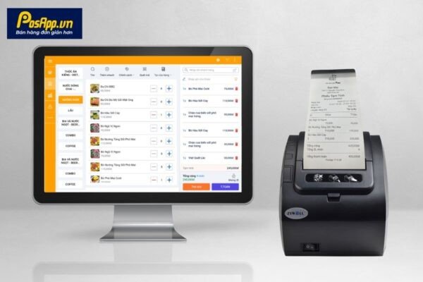 Một máy in hóa đơn nhiệt đang kết nối với máy POS màn hình cảm ứng, sẵn sàng cho việc in hóa đơn tại quầy thu ngân.