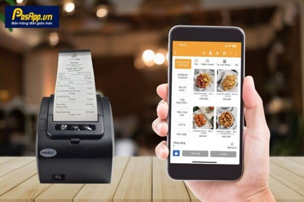 Một chiếc máy in hóa đơn nhiệt Bluetooth nhỏ gọn đang được sử dụng để in hóa đơn từ một chiếc máy tính bảng.