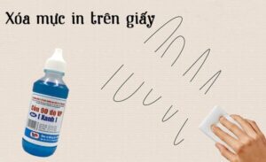 Sử dụng bông gòn thấm acetone để tẩy mực in trên giấy