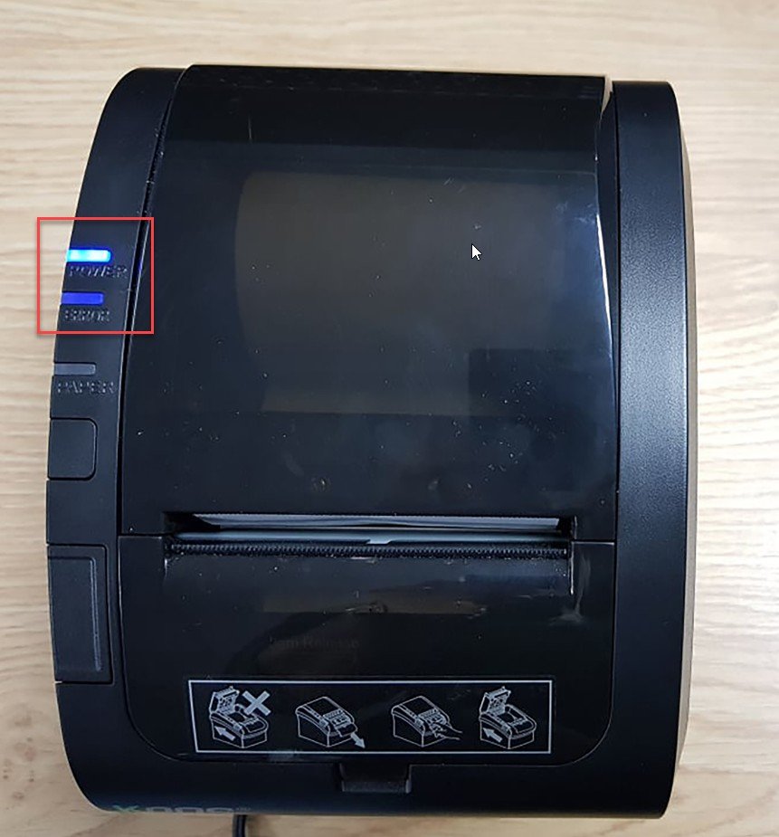 Nhấn nút feed trên máy in bill để kiểm tra giấy và đầu in