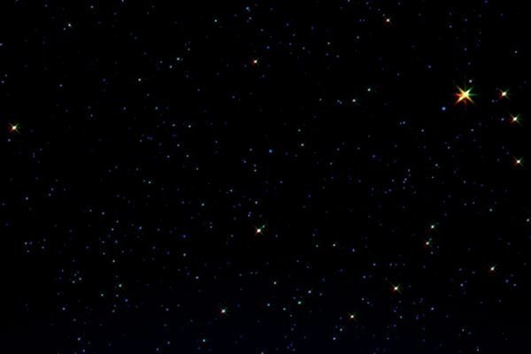 Hình nền máy tính màu đen với các vì sao lấp lánh trong vũ trụ tối