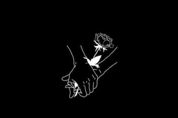 Hình nền máy tính màu đen với hai bàn tay đan chặt vượt qua bóng tối