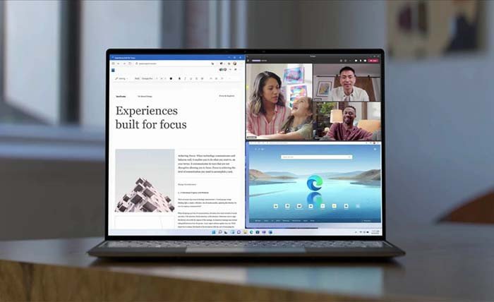 Người dùng đang làm việc trên laptop với nhiều cửa sổ, minh họa hiệu quả của việc quay video màn hình máy tính