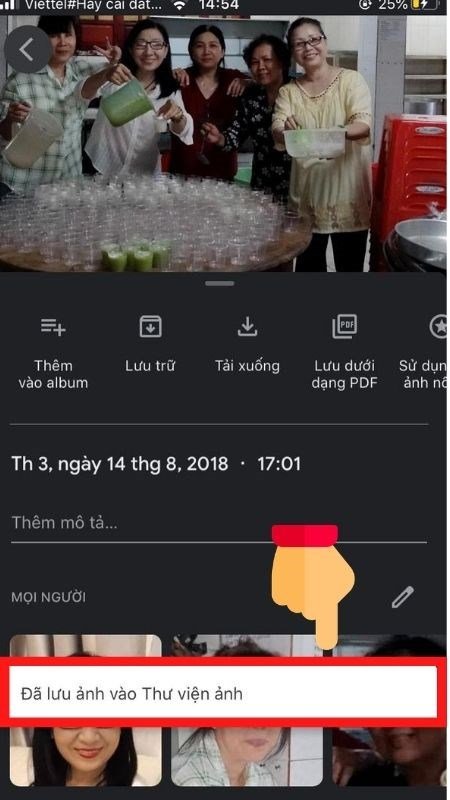 Phone screen showing Google Photos, download complete notification