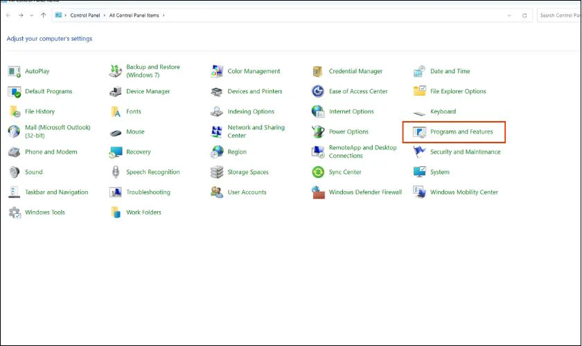 Giao diện Control Panel trên Windows, chọn Programs and Features để gỡ các ứng dụng không mong muốn và quản lý máy tính tự cài phần mềm