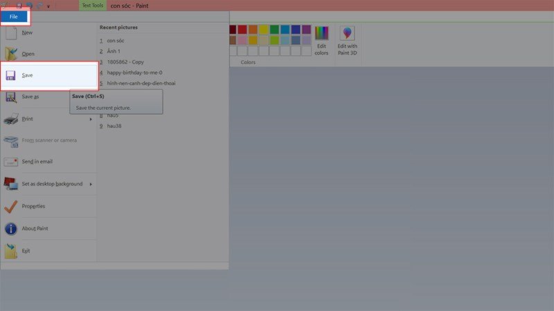 Người dùng đang lưu ảnh đã cắt trong Paint bằng cách chọn File > Save.